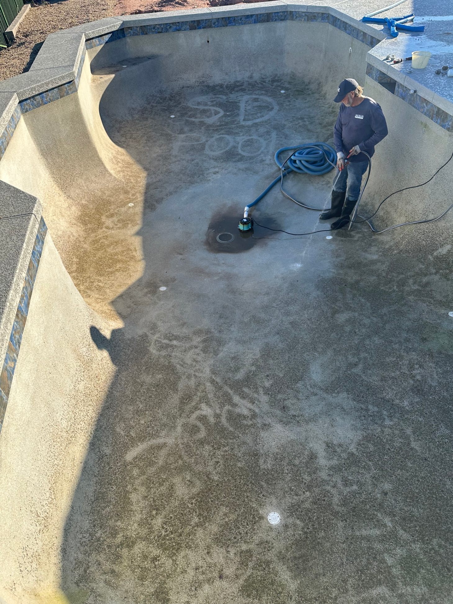 Pool being drained and cleaned by Sun Devil technician